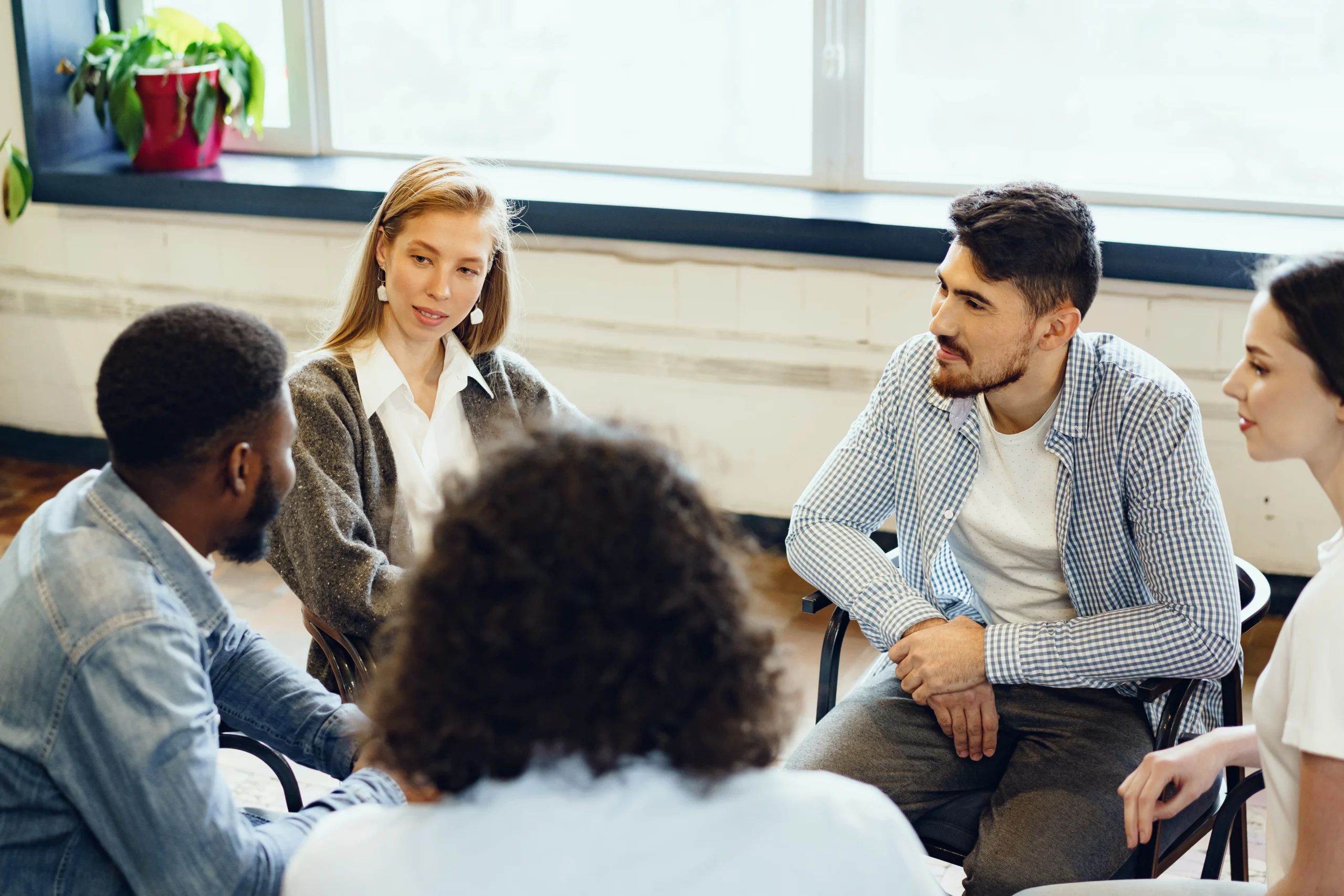 young-people-sitting-circle-having-discussion 2